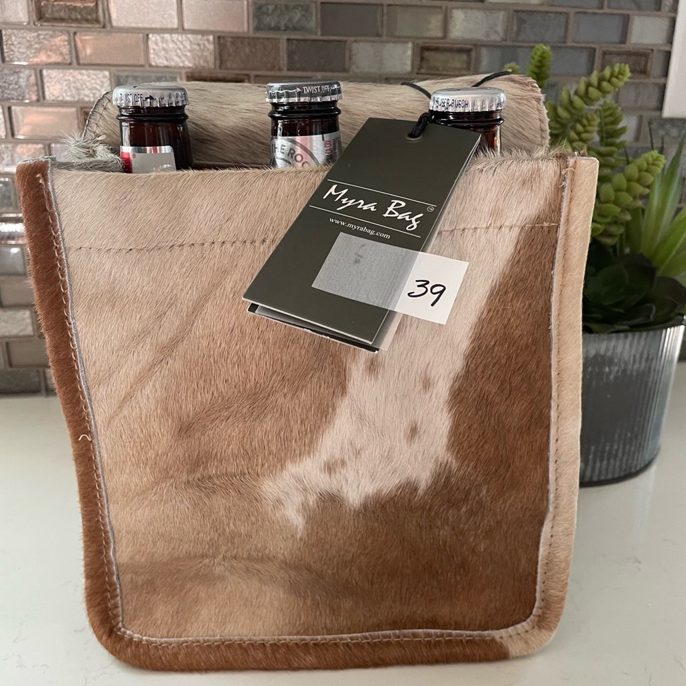 Beer tore/caddy. Holds six. Cowhide
